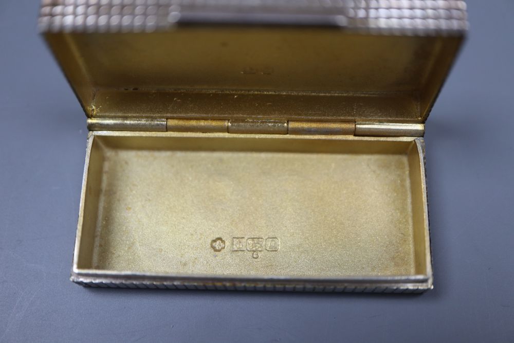 A modern cased Asprey & Co silver pill box, 51mm, a Jensen gilt sterling 1977 spoon and two servers.